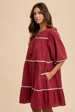 将图片加载到图库查看器,Tassel Contrast Trim Tie Neck Half Sleeve Tiered Dress – Bohemian-Inspired Dress with Tassel Details, Adjustable Tie Neck, and Tiered Design for a Flowing, Feminine Silhouette