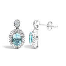 Load image into Gallery viewer, .925 Sterling Silver Diamond Accent and Oval Blue Topaz with Beaded Halo Drop Stud Earrings (I-J color, I1-I2 Clarity)