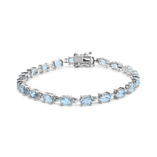 Load image into Gallery viewer, .925 Sterling Silver 11.0 Cttw Oval Shaped Created Light Blue Topaz Link Bracelet - 7 inch