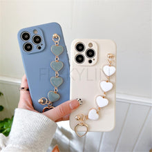 Load image into Gallery viewer, Soft Silicone Love Heart Chain Luxury Soft Flexible with Love Heart Chain Bracelet Hand Strap Girly Women Protective Cover for iPhone Wrist Bracelet Phone Case For iPhone 12 13 14 Pro Max Mini 11 Pro Max X XS Max XR 7 8 Plus