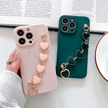 Load image into Gallery viewer, Soft Silicone Love Heart Chain Luxury Soft Flexible with Love Heart Chain Bracelet Hand Strap Girly Women Protective Cover for iPhone Wrist Bracelet Phone Case For iPhone 12 13 14 Pro Max Mini 11 Pro Max X XS Max XR 7 8 Plus