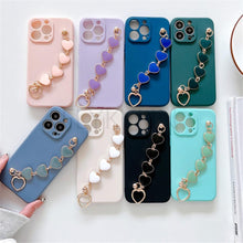 Load image into Gallery viewer, Soft Silicone Love Heart Chain Luxury Soft Flexible with Love Heart Chain Bracelet Hand Strap Girly Women Protective Cover for iPhone Wrist Bracelet Phone Case For iPhone 12 13 14 Pro Max Mini 11 Pro Max X XS Max XR 7 8 Plus