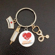 Load image into Gallery viewer, Creative Doctor Keychain Unique Personality Syringe Stethoscope Pendant Keychain Cartoon Colorful Handbag Pendant Keychain Doctor Injection Stethoscope Picture Keychain Round Dome Pendant Women Alloy Keychain