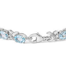 Load image into Gallery viewer, .925 Sterling Silver 16.0 Cttw Oval Blue Topaz and Diamond Accent Tennis X Link Bracelet (I-J Color, I1-I2 Clarity) - Size 7" Inch