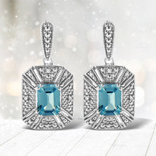 Load image into Gallery viewer, .925 Sterling Silver 7x5MM Emerald Shape Blue Topaz and Diamond Accent Art Deco Halo Style Drop and Dangle Earrings (I-J Color, I1-I2 Clarity)
