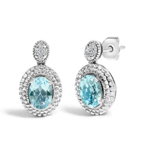 Load image into Gallery viewer, .925 Sterling Silver Diamond Accent and  Oval Blue Topaz with Beaded Halo Drop Stud Earrings (I-J color, I1-I2 Clarity)
