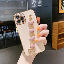 Load image into Gallery viewer, Luxury Women Silicone Phone Case Cover With Wrist Chain Bracelet for iPhone  Wristband Bracelet Hand Holder Cover for iPhone 13 12 11 Pro Max plating Case Heart Chain Cases for iPhone 7 8 Plus XR XS Max X
