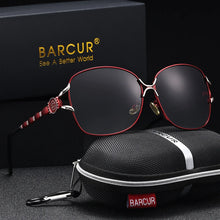 Load image into Gallery viewer, BARCUR Women’s Polarized Sunglasses – Oversized Elliptical Black Frame UV400 Protection Outdoor Fashion Mirror Leg Design High Quality Trendy Style Sunglasses for Travel Driving &amp; Summer Apparel
