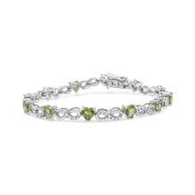 Load image into Gallery viewer, .925 Sterling Silver 1.00 Cttw Diamond and 4.00mm Lab Created Green Heart-Shaped Peridot Infinity Link Bracelet (I-J Color, I2-I3 Clarity) - 7.25"
