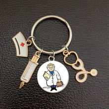 Load image into Gallery viewer, Creative Doctor Keychain Unique Personality Syringe Stethoscope Pendant Keychain Cartoon Colorful Handbag Pendant Keychain Doctor Injection Stethoscope Picture Keychain Round Dome Pendant Women Alloy Keychain
