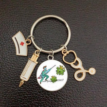 Load image into Gallery viewer, Creative Doctor Keychain Unique Personality Syringe Stethoscope Pendant Keychain Cartoon Colorful Handbag Pendant Keychain Doctor Injection Stethoscope Picture Keychain Round Dome Pendant Women Alloy Keychain
