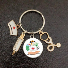 Load image into Gallery viewer, Creative Doctor Keychain Unique Personality Syringe Stethoscope Pendant Keychain Cartoon Colorful Handbag Pendant Keychain Doctor Injection Stethoscope Picture Keychain Round Dome Pendant Women Alloy Keychain
