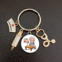 Load image into Gallery viewer, Creative Doctor Keychain Unique Personality Syringe Stethoscope Pendant Keychain Cartoon Colorful Handbag Pendant Keychain Doctor Injection Stethoscope Picture Keychain Round Dome Pendant Women Alloy Keychain
